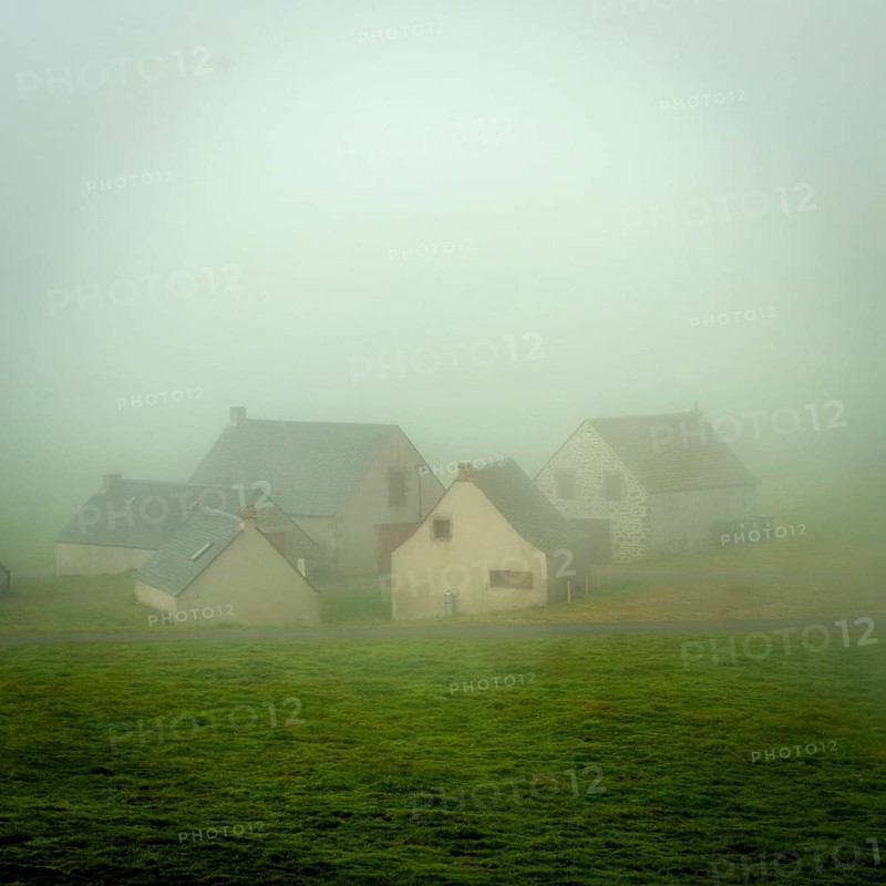 Houses of the faithrail of Brion in the mist in autum