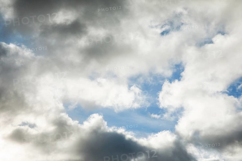 Stratocumulus clouds and blue sky windows form spectacular cloud formation in the sky during Foehn storm