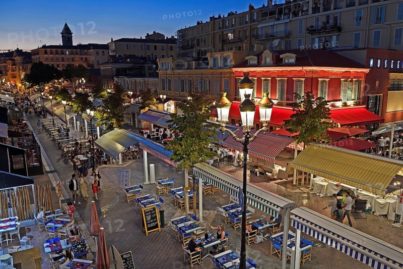 Evening hustle and bustle with restaurants and market stalls on the Cours Saleya