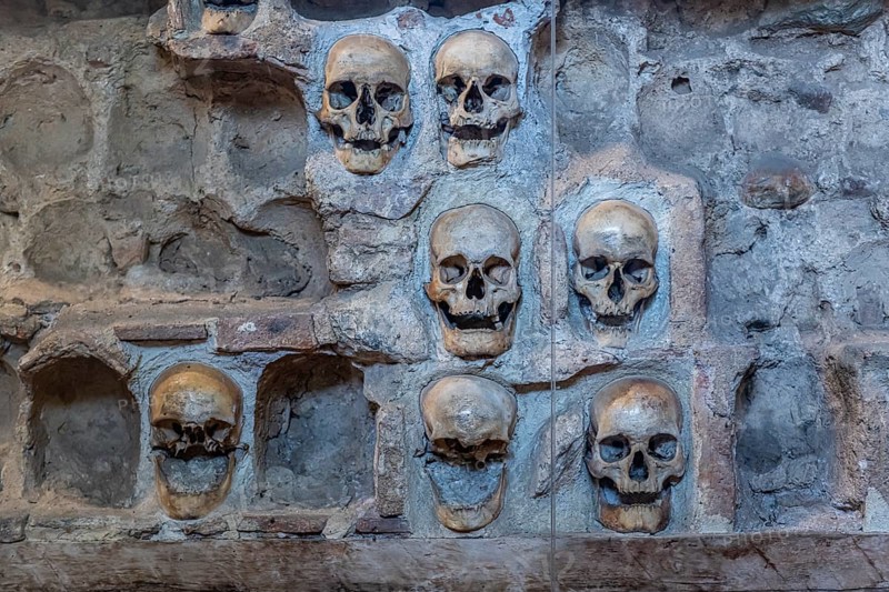 Stone structure embedded with human skulls