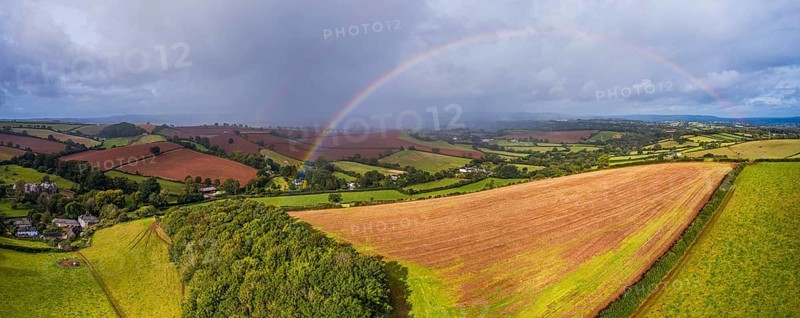 Rainbow over the Fields over Compton Castle from a drone