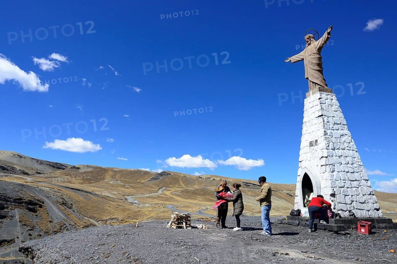 Ceremony with a shaman at the statue of Jesus at La Cumbre Pass