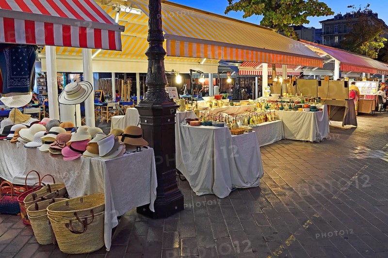 Evening hustle and bustle with restaurants and market stalls on the Cours Saleya