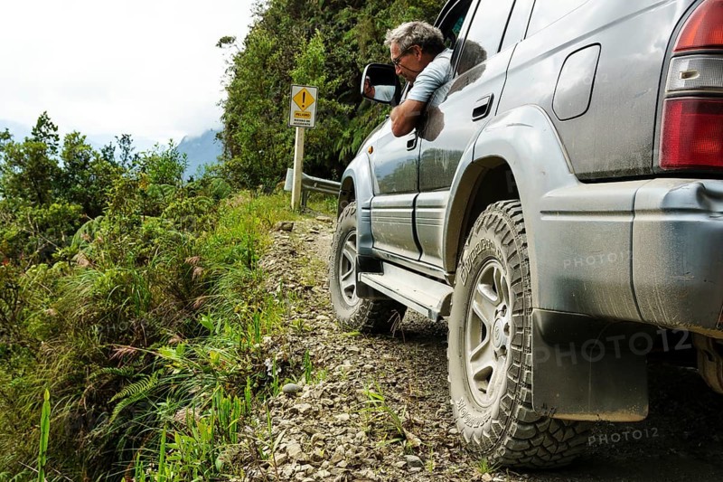 Driver checks the road in an off-road vehicle