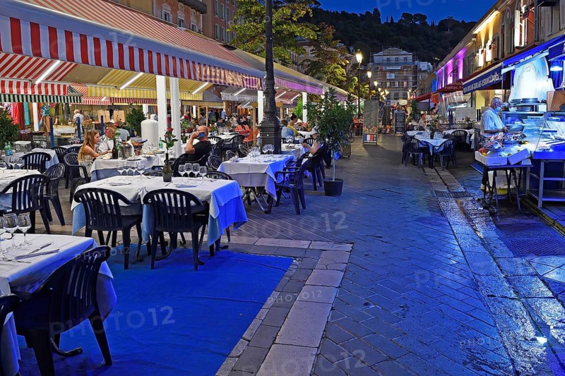 Evening hustle and bustle with restaurants and market stalls on the Cours Saleya