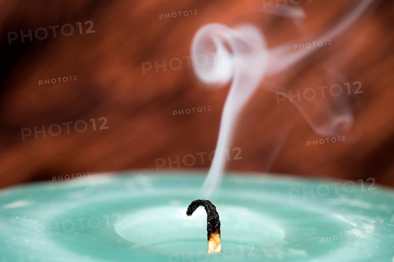 Still smoking candle wick