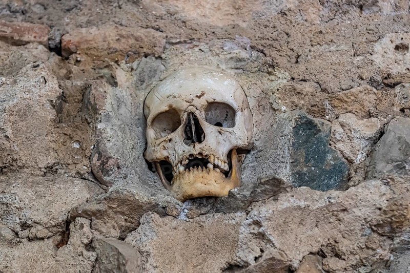 Stone structure embedded with human skulls