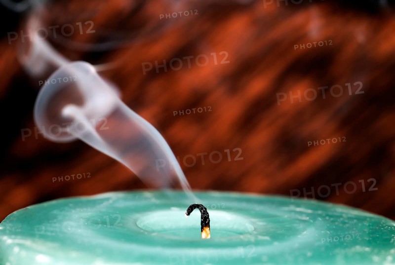 Still smoking candle wick