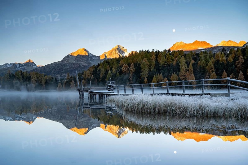 Mountain peaks reflected in Lake Staz