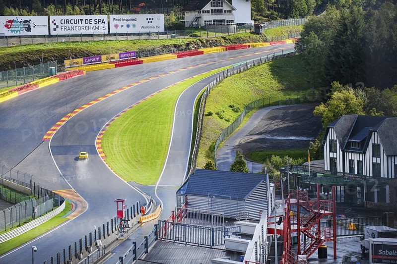 View of Porsche Cayman GT4 in curve Eau Rouge
