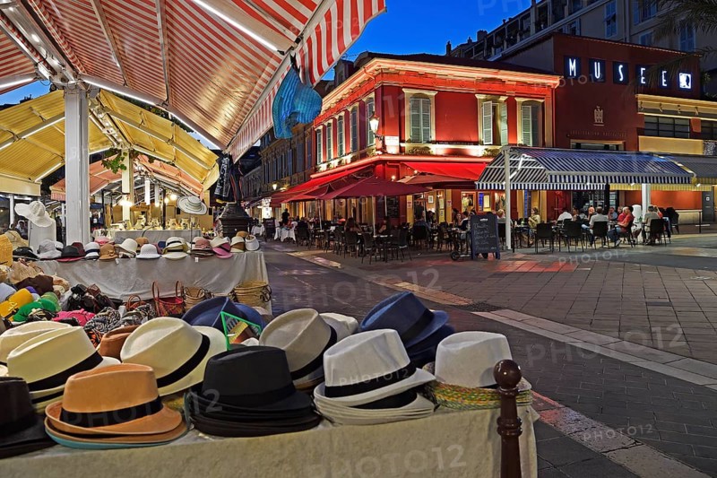 Evening hustle and bustle with restaurants and market stalls on the Cours Saleya