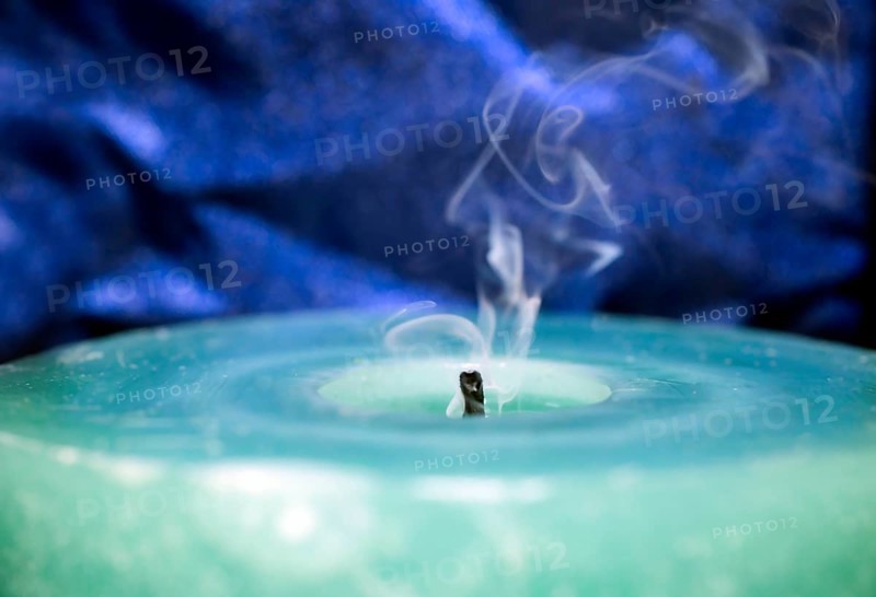 Still smoking candle wick