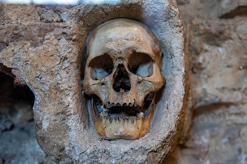 Stone structure embedded with human skulls