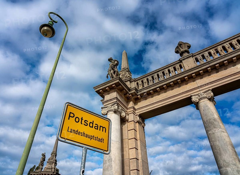 The colonnades with the Potsdam city entrance sign at the Glienicke Bridge