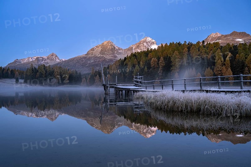 Mountain peaks reflected in Lake Staz
