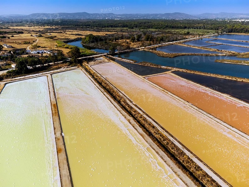 Amazing colors of sea salt ponds called salines shortly before salt extraction in Portugal
