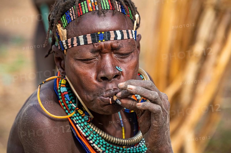 Traditional dressed women smoking