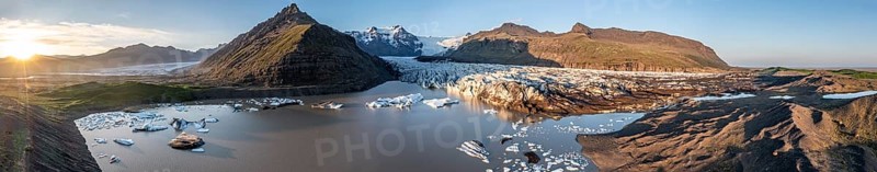 Glacial river in front of Mountains with Hvannadalshnukur