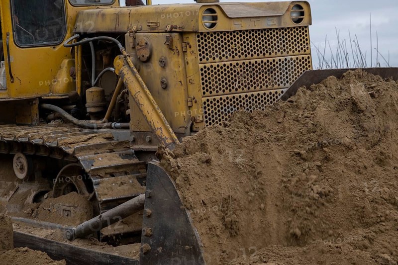Bulldozer removes dam in the delta Danube river
