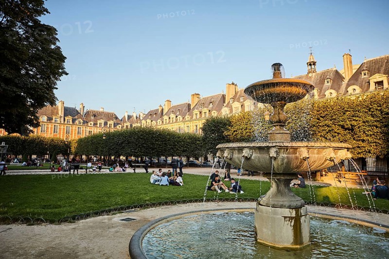 Evening atmosphere with fountains in front of medieval facades
