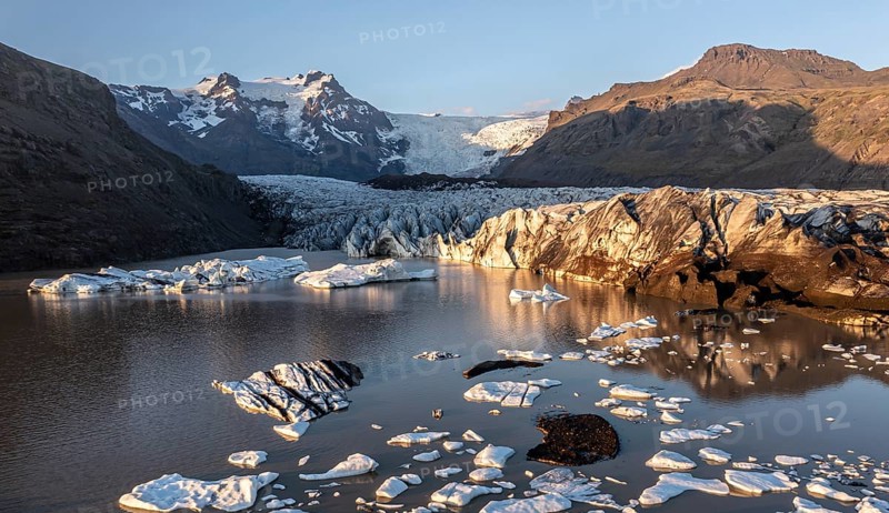 Glacial river in front of Mountains with Hvannadalshnukur
