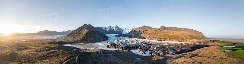 Glacial river in front of Mountains with Hvannadalshnukur