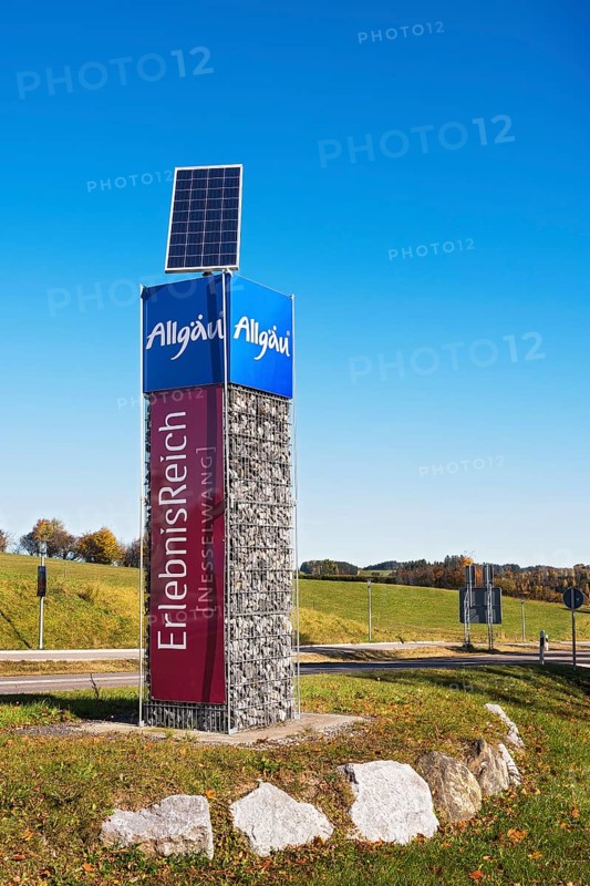 Column with advertising for Allgaeu and Nesselwang with solar panel