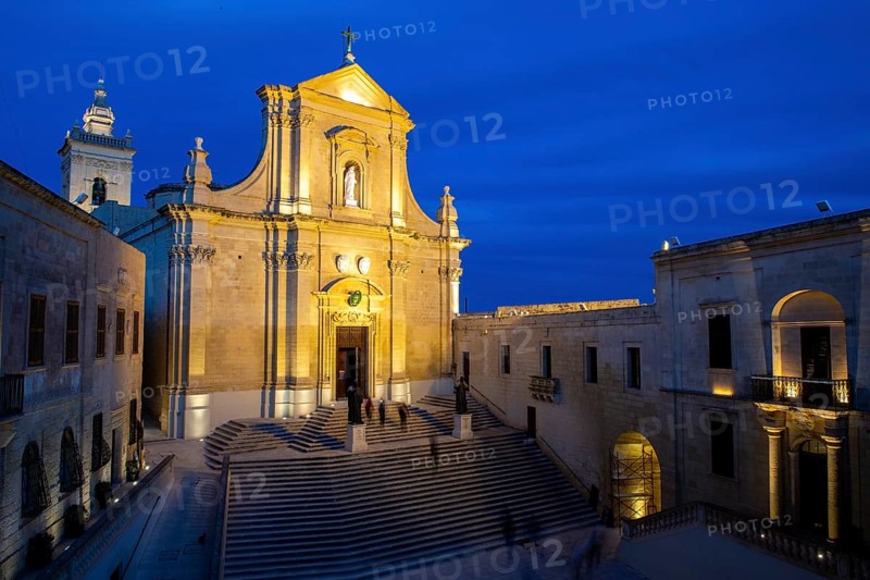 Illuminated St Marija's Cathedral in Gozo Citadel at dusk in blue hour