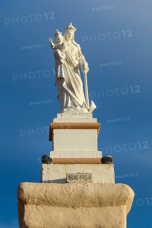 Statue of Madonna Mary Mother of God on Ramla Bay Beach