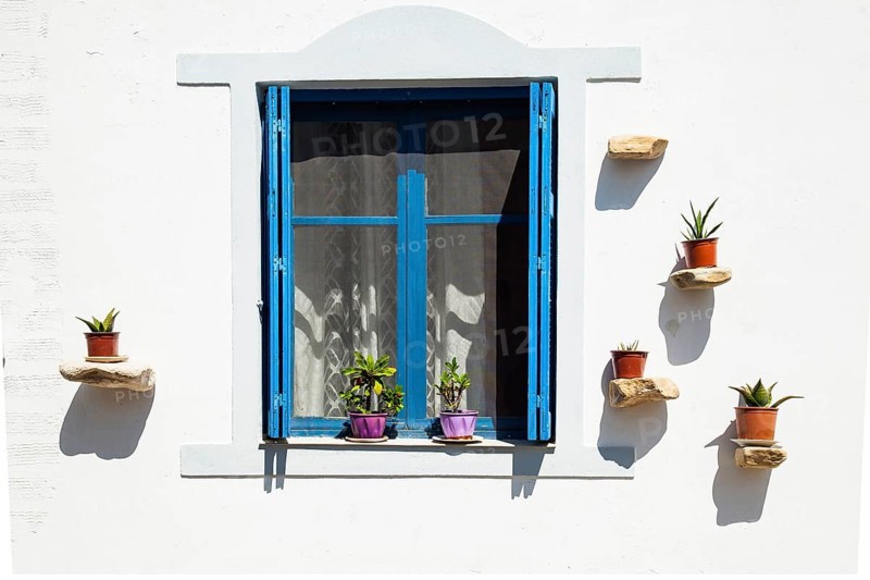 Windows facade detail of a traditional Greek house on Crete