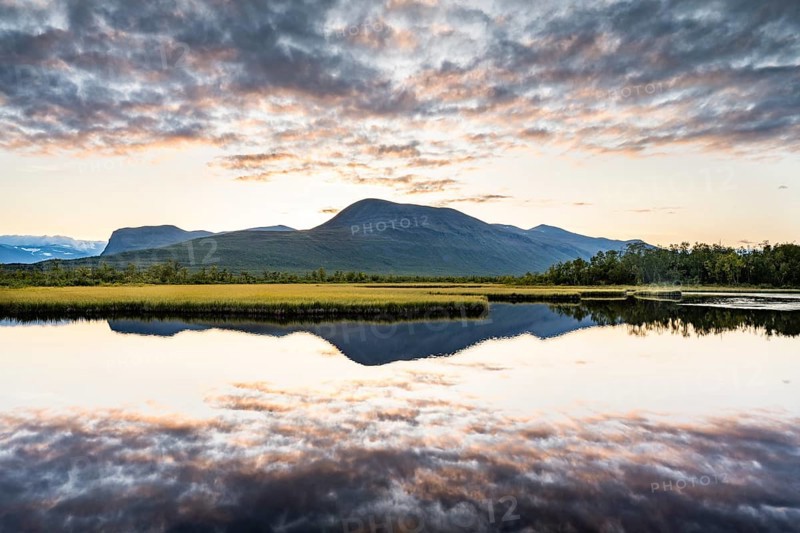 Mountains reflected in small lake