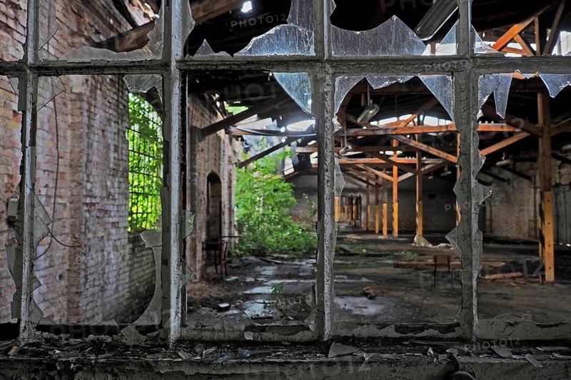 View through broken window in railway station