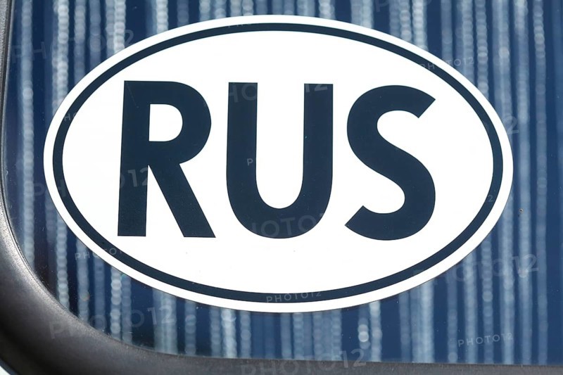 Russian car number plate on a car window