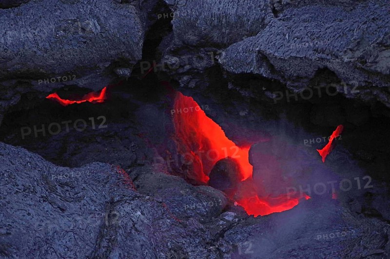 Magma glows under cooled lava