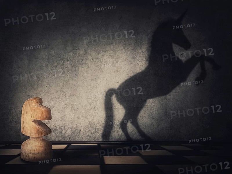 Surreal transformation of the knight chess piece into a wild and powerful unicorn