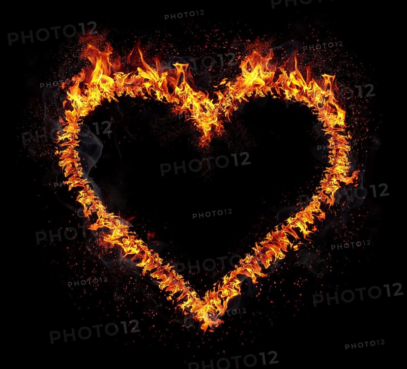 Flaming heart isolated on black background