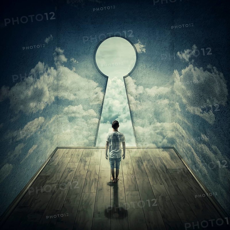 Abstract idea with a person standing in front of a big keyhole doorway surrounded by limitations daily routine concrete walls with clouds texture
