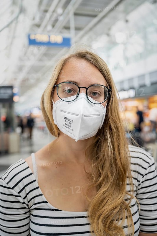 Young woman wearing glasses and an FFP-2 mask