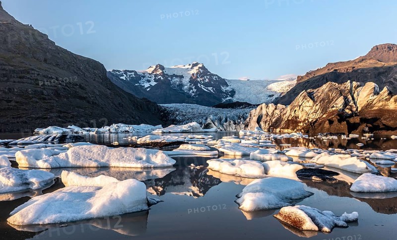 Glacial river in front of Mountains with Hvannadalshnukur