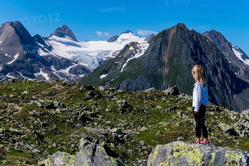 Young girl posing before the Swiss Alps
