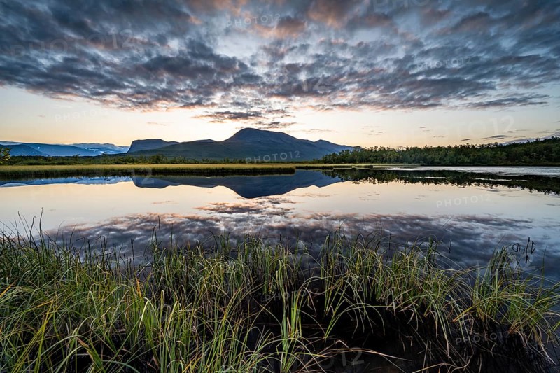 Mountains reflected in small lake