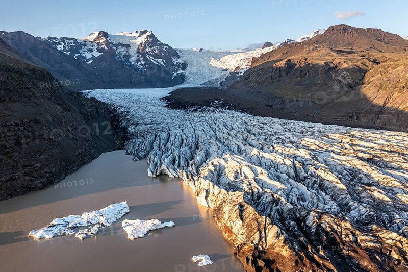 Glacial river in front of Mountains with Hvannadalshnukur