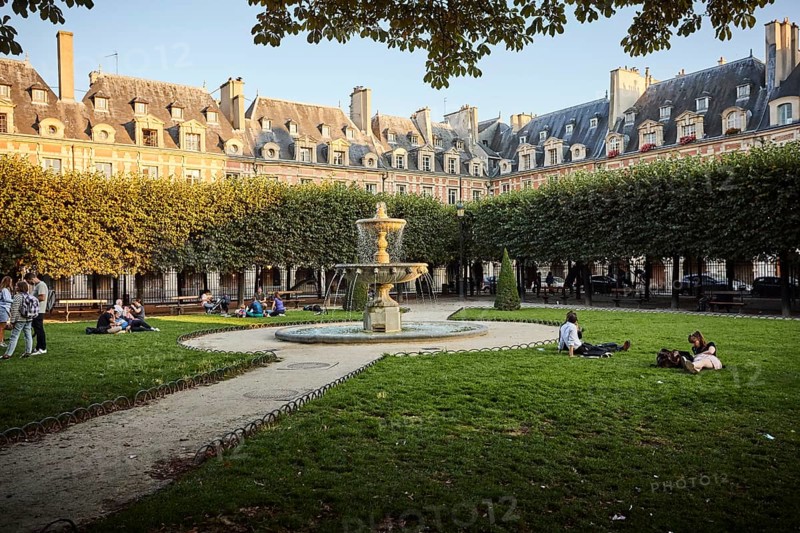 Evening atmosphere with fountains in front of medieval facades