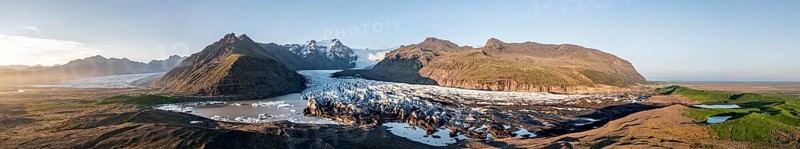 Glacial river in front of Mountains with Hvannadalshnukur