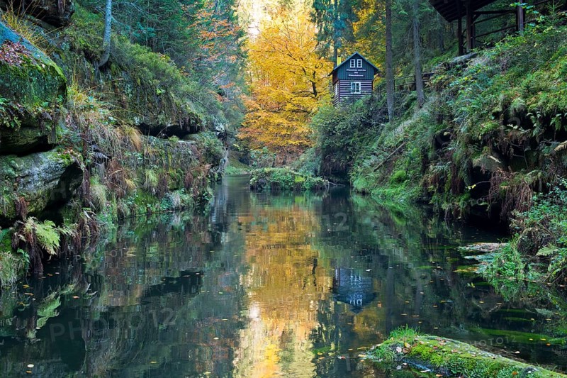 Autumn in the Edmundsklamm gorge with the river Kamenice
