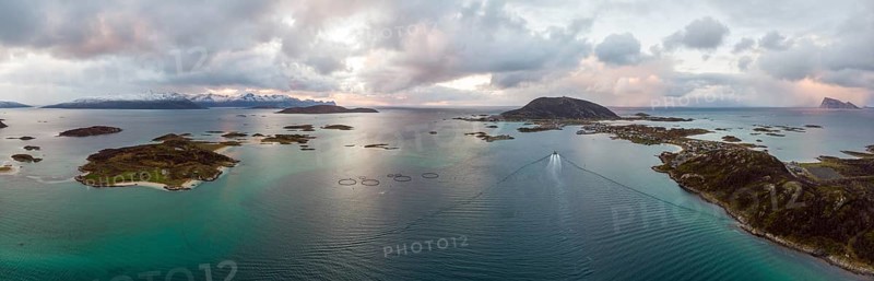 View over the sea with fish farms to Baltsfjorden and the mountains of Balten