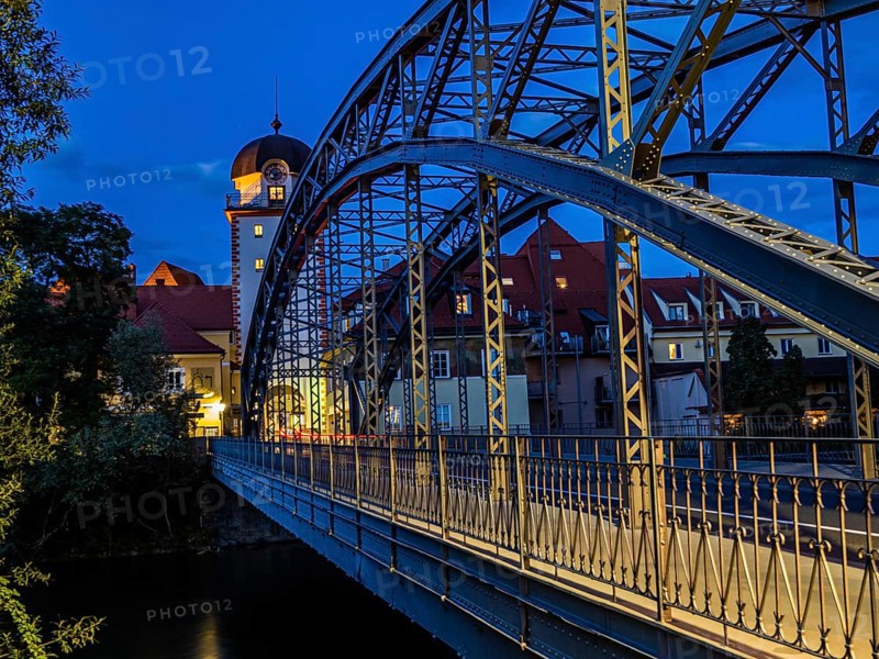 Waasen bridge over the river Mur and historic toll tower