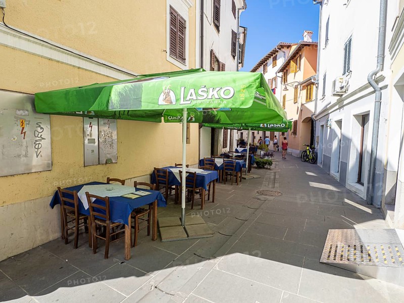 Restaurant tables in an alley in the old town of Izola