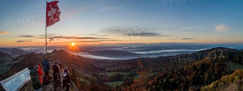 Sunrise with autumn fog with alpine panorama