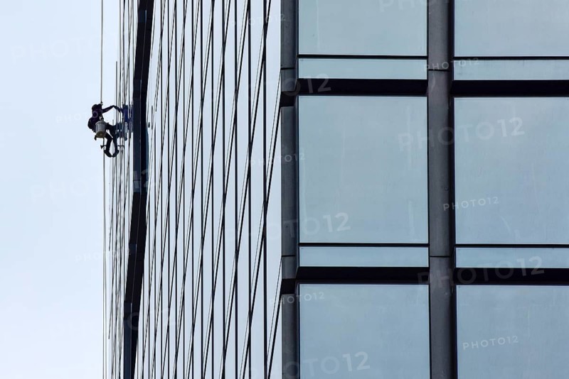 Man cleaning window pane